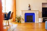 The living room has Klein blue accents throughout.