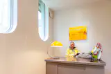 Mike in his yellow-themed office, where he likes to sit at his desk and write songs.