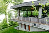 The whole building is nestled into the earth, making the surrounding woods feel even closer. “I’m not the outdoor type,” Mike says. “I wouldn’t want to be outside, but it’s the closest thing to it while being inside.” Microphones on the balcony can pipe the sounds of the outdoors into the recording studio instead of keeping them out.