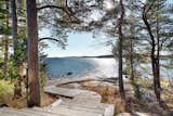 The main house, the guesthouse, the sauna, and the ocean are all connected by Siberian larch paths.