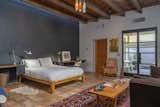The primary bedroom has clerestory windows and a reclaimed barn wood ceiling.