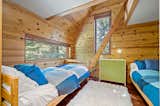 A ladder leads to a lofted nook in one of the bedrooms.
