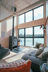 A double-height ceiling creates an expansive feel in the living space.