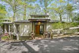 The Glass-Encased Dining Room Is the Star of This $1.5M Hudson River Midcentury