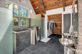 The bathroom’s striking soaking tub is made from stainless steel.