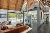A soapstone fireplace by Tulikivi divides the living and dining areas.