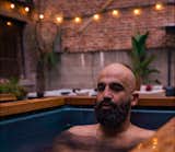 A guest takes a cold plunge at Alchemy.