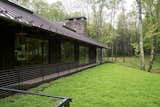 A view across the planted roof reveals the Marvin windows and doors from the Ultimate collection tucked beneath the extended eaves.