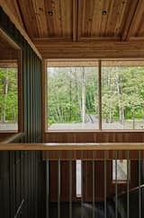The stair hall creates a natural flow from the lower level to the airy upper volume. "Especially for the first time, it creates a moment of revelation," explains Gabe. "You're delivered up to the pavilion and the view of the farm through the trees."