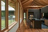 Glulam Douglas fir beams and Marvin Ultimate windows define the treetop kitchen. The windows were selected for their ability to blend with the timber structure, creating what architect Gabe Hodge calls "openings in the walls, rather than windows."&nbsp;