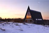 Frosted glass panes at one end of the cabin let light into the bathroom while keeping it private.  Photo 5 of 23 in This Clever Twist On an A-Frame Cabin? It Started in a Classroom