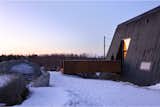 You enter at the very center of the building, “right at the groin, the crux, the crank,” as Braithwaite describes it, approaching along a gangway clad in weathering steel.  Photo 10 of 23 in This Clever Twist On an A-Frame Cabin? It Started in a Classroom