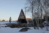 “We made the house more complicated by lifting it up on stilts, which is something our firm tends to do,” Braithwaite says.  Photo 23 of 24 in This Clever Twist on an A-Frame Cabin? It Started in a Classroom