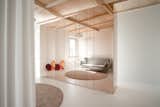 Carolina’s room balances openness and privacy with a curtain separating the space. The Clam sofa bed by Ligne Roset and a Microheaven rug soften the space, which can transition into a guest room.