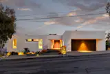 The home’s massing and window placement are designed to regulate its interior temperature.