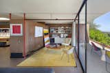 Instead of reaching to the ceiling, the walls stop around a foot shy, connecting the rooms.