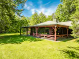A three-sided porch wraps around the living room.