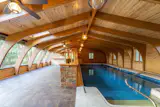 The heated pool and jacuzzi occupy their own separate recreation wing of the home.