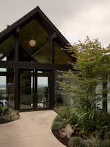 The exterior is clad in ebony-stained cedar siding.