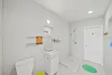 One of the bathrooms is wrapped in tiles from floor to ceiling.