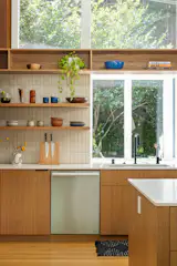 The kitchen features oak cabinetry, birch drawers, and maple millwork.
