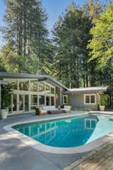 The outdoor pool is filled with saltwater.  Photo 11 of 13 in Two Writers Revamped This $4.3M Midcentury to Feel Like a Coffee Shop