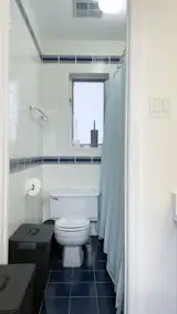 Before: The revamp altered this bathroom’s layout and introduced new finishes. “We were just putting some shine back on this really cool modernist row house,” says Bessai.