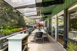 The cantilevered deck is accessible from both the living room and primary bedroom.