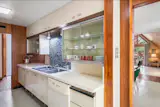 The Roof of This $775K Memphis Midcentury Curves All the Way to the Ground - Photo 7 of 15 - 