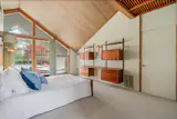 The Roof of This $775K Memphis Midcentury Curves All the Way to the Ground - Photo 10 of 15 - 