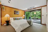 The primary bedroom opens directly to the backyard.