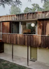The home is clad in original board-and-batten redwood siding.&nbsp;
