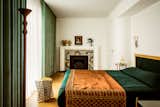 How They Pulled It Off: A Glittering Snake Mosaic Fireplace in a Whimsical Parisian Apartment