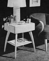 A 1950s catalog shows a room furnished with the M 166 Drop Leaf Table, as well as the M 154 A "Dog Biscuit" Dining Chair, which is among the company’s more popular midcentury pieces.