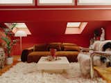 The red paint Charly chose for his flat lends warmth and coziness to the upper story—even on the grayest days.