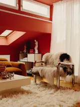 “As you can see, I really like rugs,” Charly says, gesturing to the one from HK Living draped across the chair.