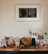 Cherished objects—clay spoons from the New Mexico ceramicist Brandon Adriano Ortiz, greeting cards from loved ones, 3D-printed atole bowls, carved gourds, and an Incienso de Santa Fe incense holder—sit atop a flat-file cabinet and in front of an Icy &amp; Sot work.