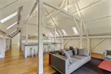 The barn’s post-and-beam walls and ceiling pay homage to classic New England architecture.
