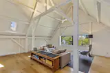 The converted barn is now in use as a two-car garage on the first floor and a guest apartment on the second.