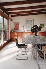 Original louvered windows add charm to the dining room while making the most of the warm Florida climate.