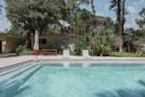 A new saltwater pool with tabby concrete decking enhances the retro feel of the home, evoking the style of Slim Aarons’ iconic photos.