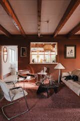 The entry foyer now serves as a lounge and music room.