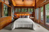 The upper-level primary bedroom is accessible via a separate entrance.