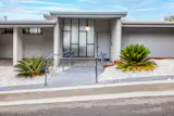 The multilevel home—and its show-stopping views—are tucked behind a modest front facade.