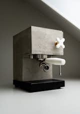 The espresso maker has a concrete shell cast by hand, making each one slightly different than the next.