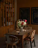 The table and stools are by the couple’s friend and collaborator Marissa Naval of Casa Naval. In the dining room, rustic mismatched pieces create a warm setting. “Most of the furniture is a mix of items from old collections found at flea markets, inherited from family, or repurposed from past projects,” says Luis.