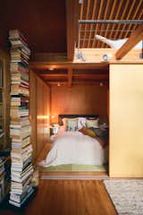 A Ptolomeo vertical bookcase by Bruno Rainaldi stands outside the couple’s bedroom, which features a John-John bed from Poltrona Frau and Awa side tables from B&B Italia. The tatami mats are original to the house, which was designed in 2002 by architect Mikio Tai, who worked with George and Mika on updates.