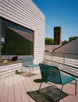 The house had distinct, angular geometry, and to build on that approach while not replicating it, Baab used curves in the renovation, including a spiral staircase and on select walls of the addition. The Lipnicks enjoy how the rooms in the addition offer privacy but retain a sense of being connected to the larger space. There’s even a secluded deck, with Auma chairs from Article.