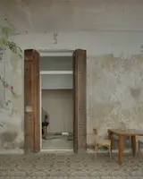 Vintage Thonet chairs and a Canto table by Ries sit outside the home’s listening room and study.