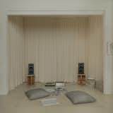 In the listening room, which is carpeted and lined in drapes for soundproofing, custom floor cushions by Luna/Oks invite lounging. “I was looking for sophistication without pretension,” says Marcos of the project.